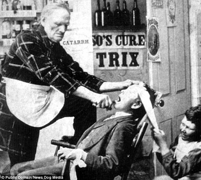 A horrifying tooth extraction from the late 1800s or early 1900s. The patient had to have his head restrained with a towel to stop him from moving too much.